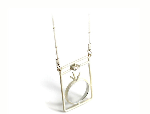 Assembly Ring Styled Pendant on a Long Silver Chain