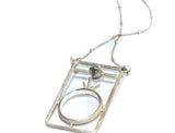 Assembly Ring Styled Pendant on a Long Silver Chain